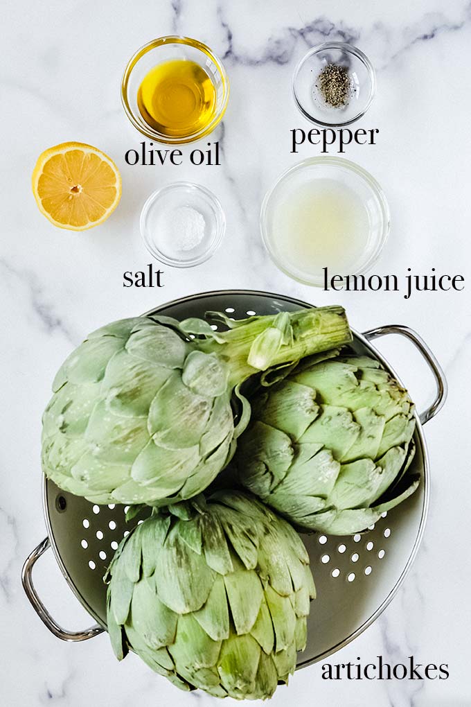 All of the ingredients to make grilled artichokes.