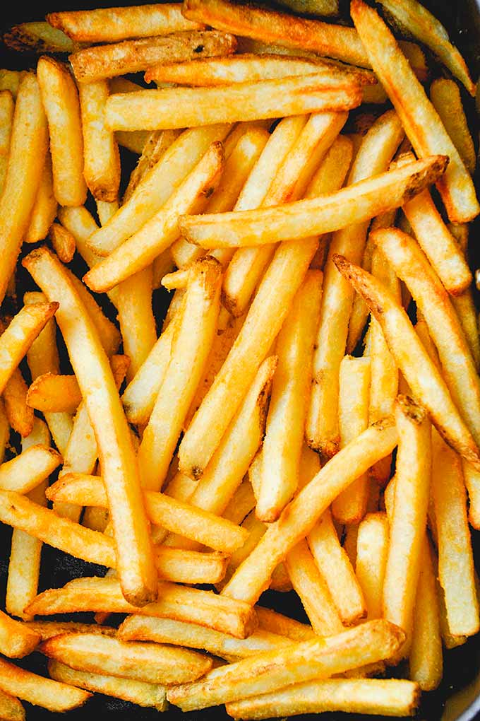A close up of a bunch of straight fries.