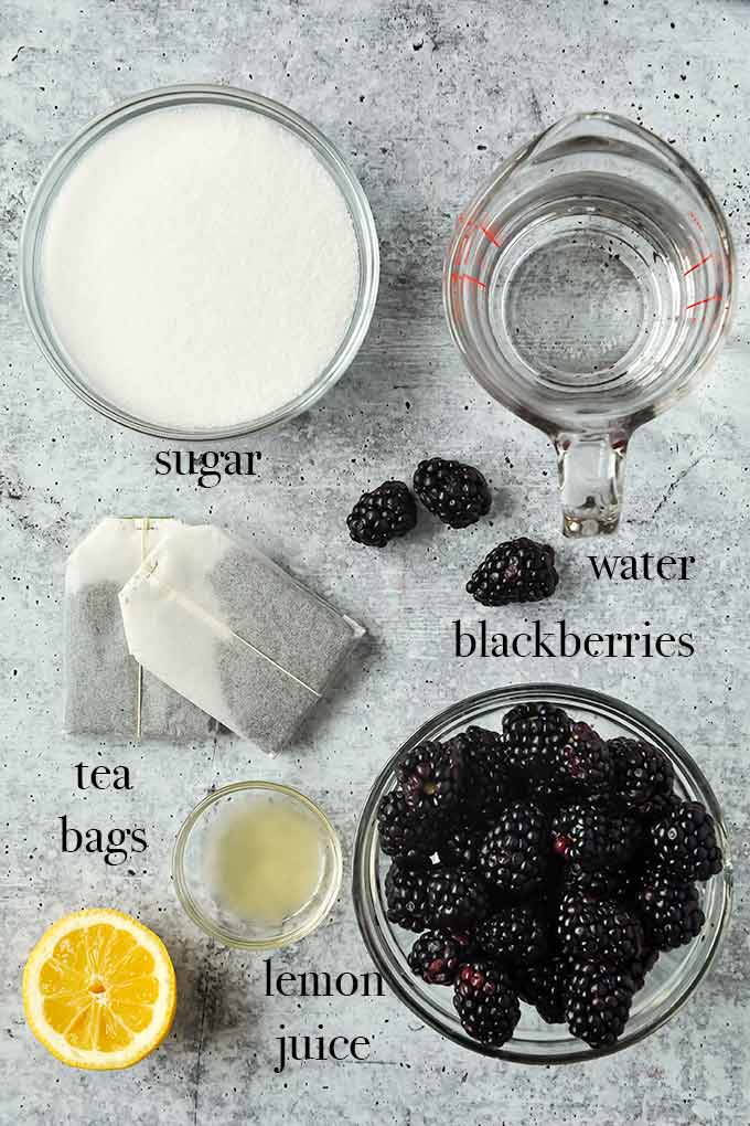 All of the ingredients needed to make blackberry iced tea.