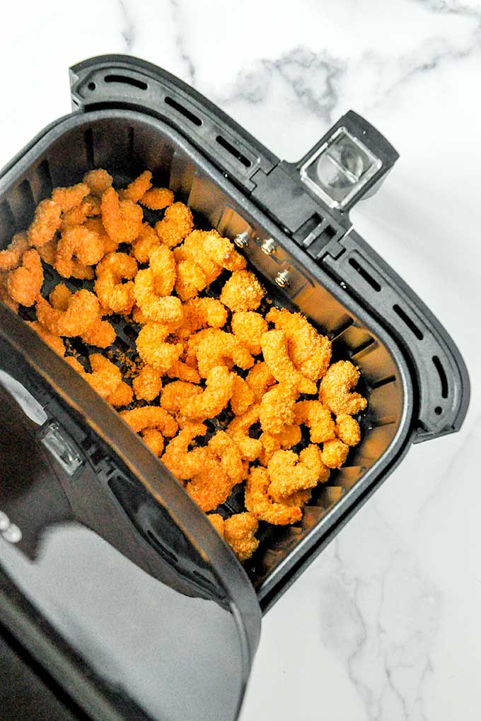 Add frozen shrimp directly into the air fryer basket then set cook time.