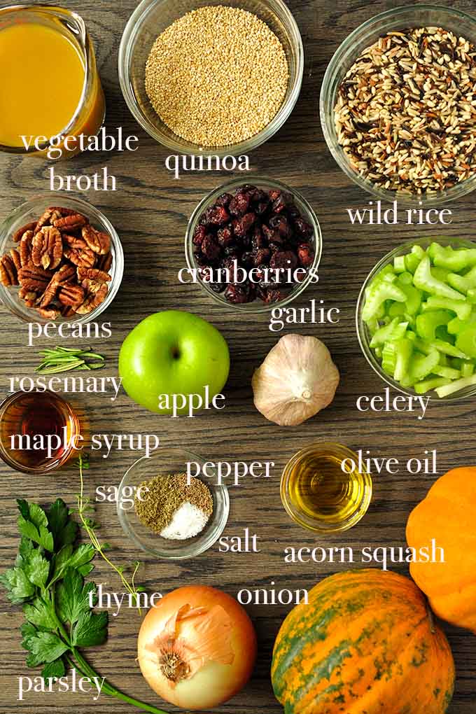 All of the ingredients to make stuffed acorn squash including celery, apple, wild rice, quinoa, and cranberries.
