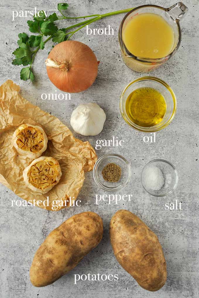 All of the ingredients to make potato garlic soup.