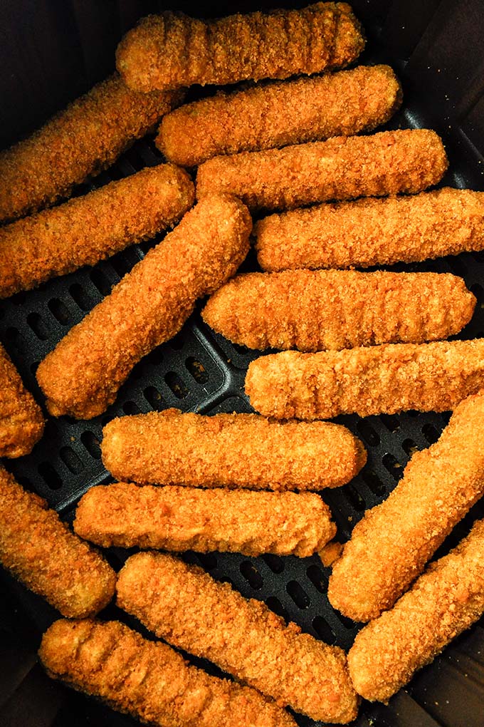 Air fried cheese sticks that were freshly cooked.