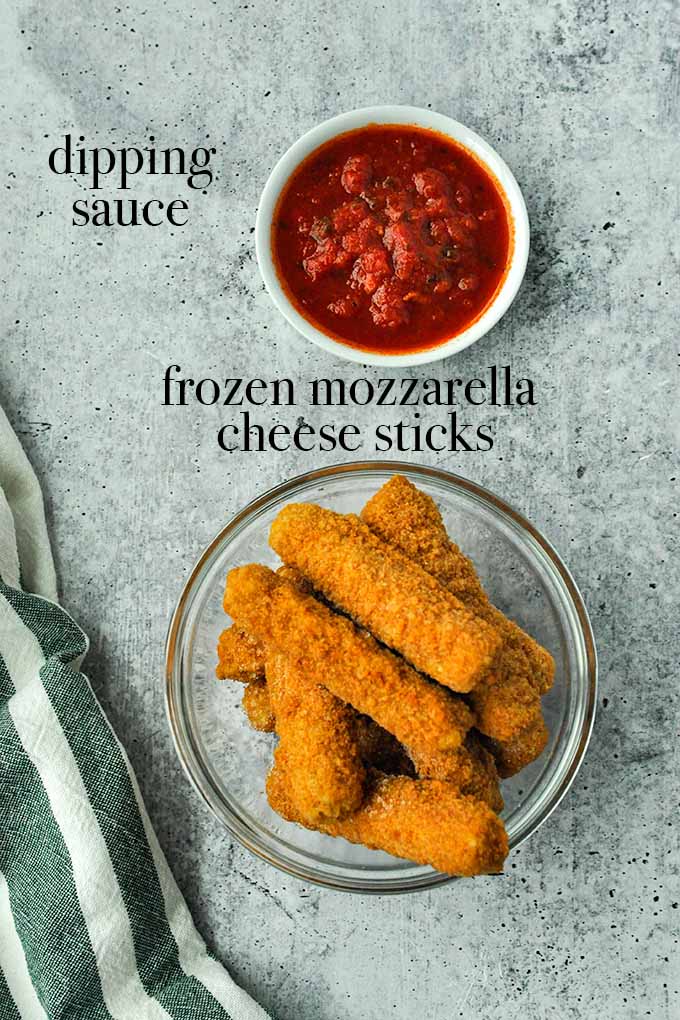 All of the ingredients needed to make frozen mozzarella sticks in air fryer.