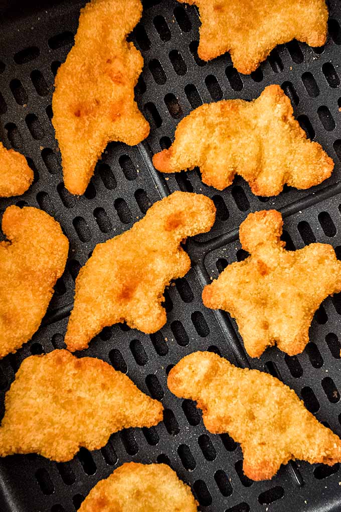 Air fryer dino nuggets in the air fryer.