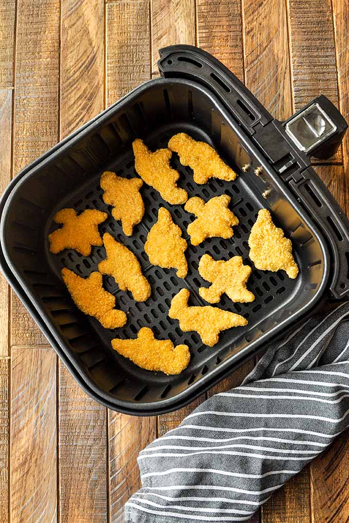 Step by step instructions to make air fryer dino nuggets.