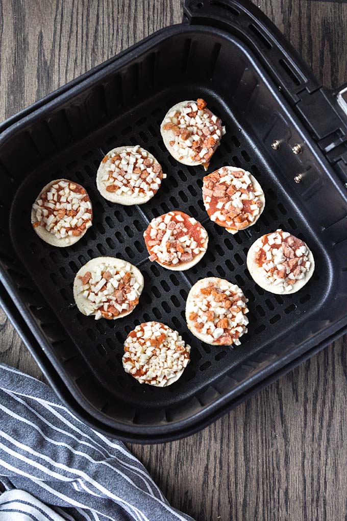 Step by step instructions on making bagel bites in air fryer.