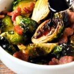 Up close of balsamic glaze on air fryer Brussels sprouts with bacon.