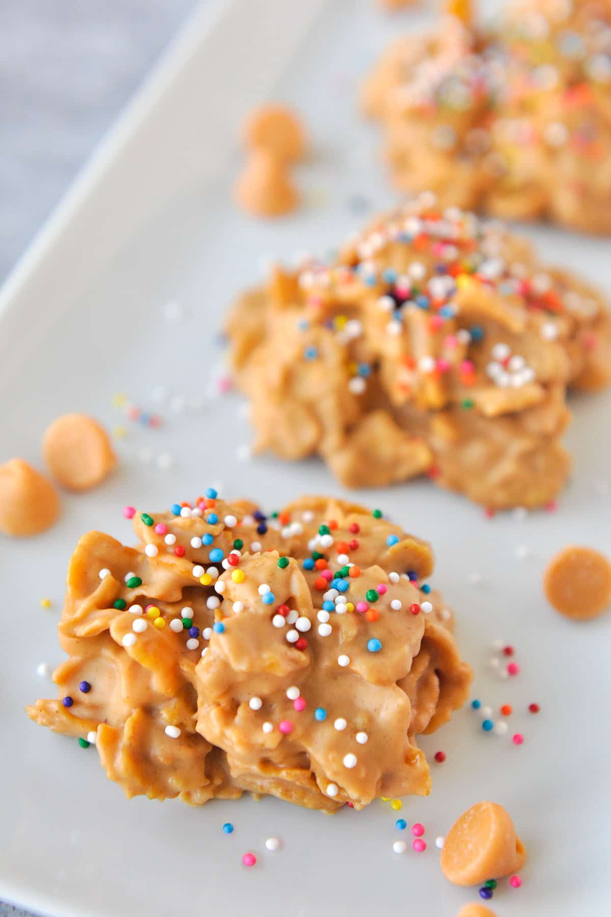 Butterscotch Cornflake Cookies topped with sprinkles.