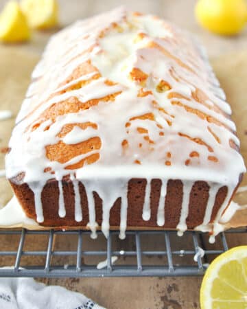 Lemon loaf with the glaze dripping down the sides.