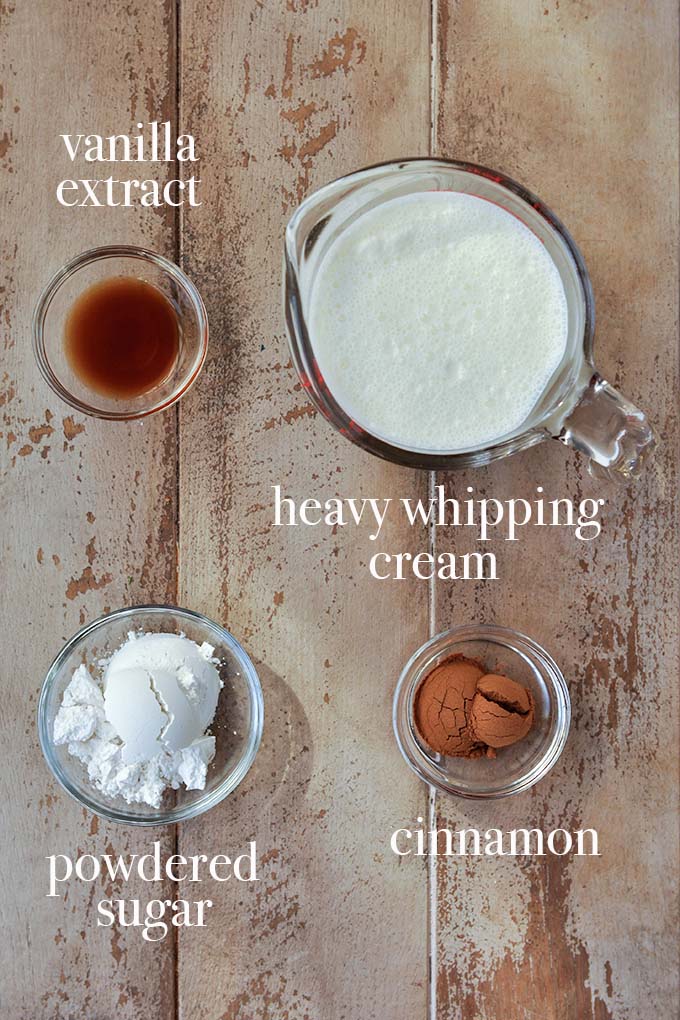 All of the ingredients needed to make vanilla cinnamon whipped cream.