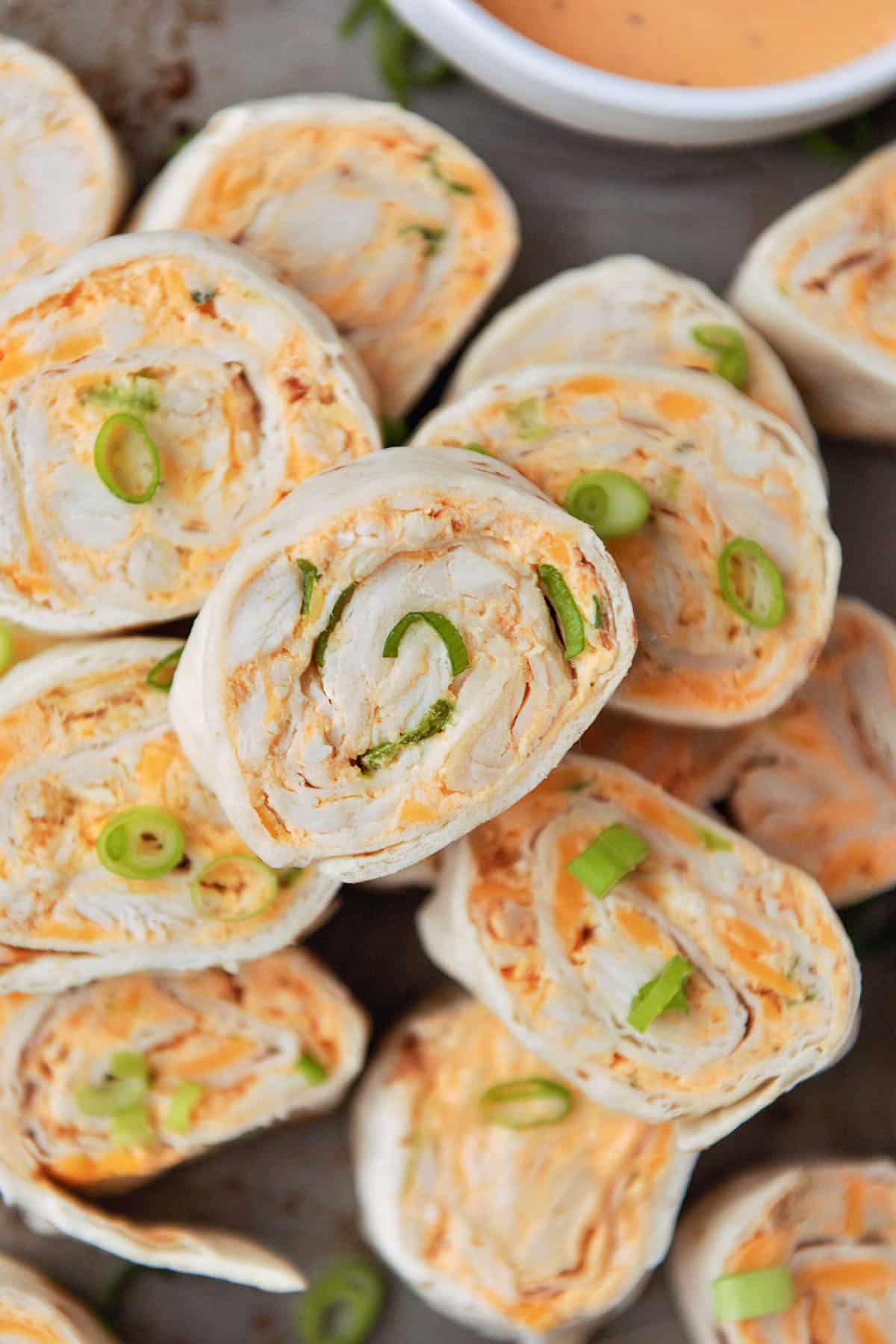 Above view of a pile of chicken pinwheels.