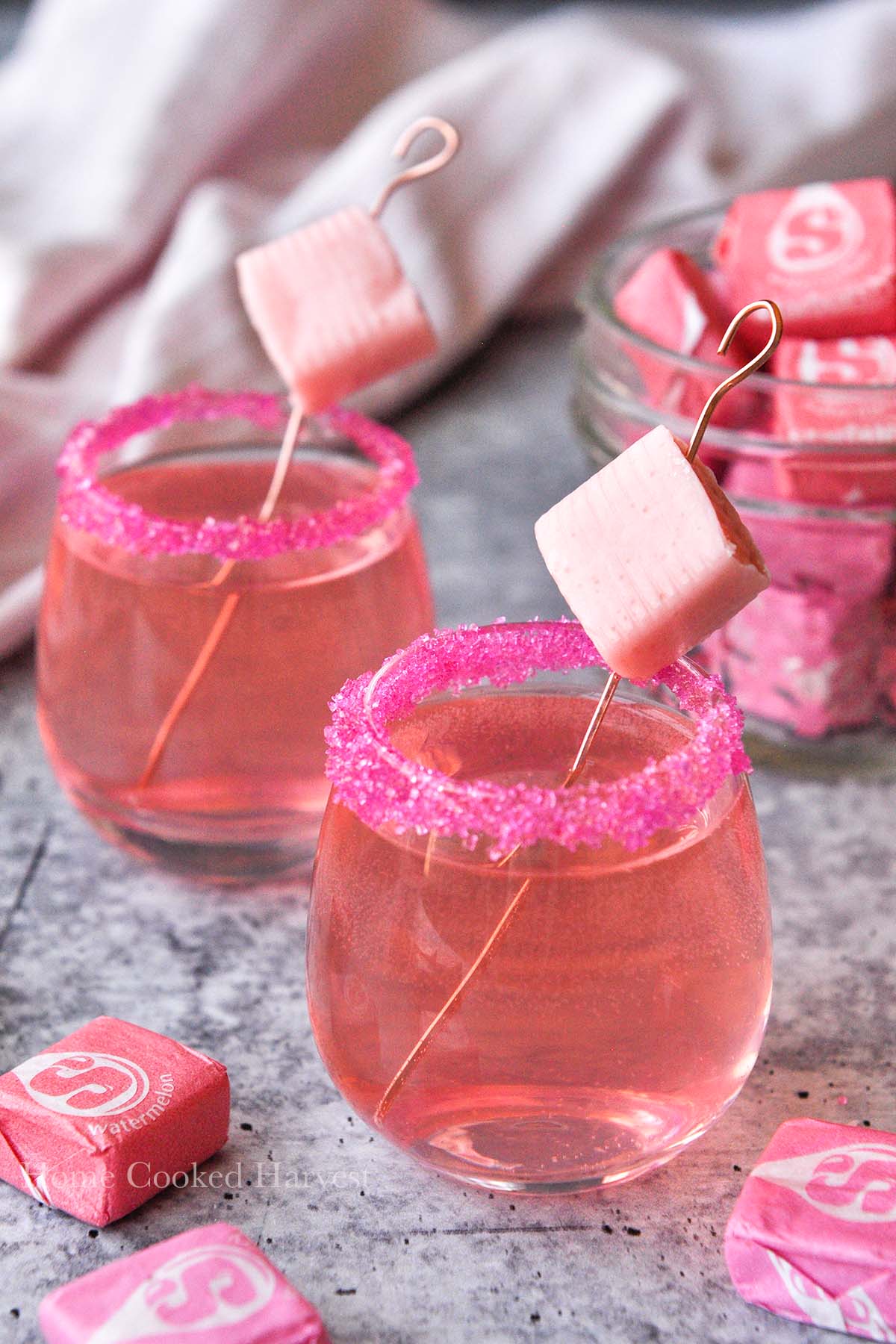 Two starburst shots with a small jar of starbursts.