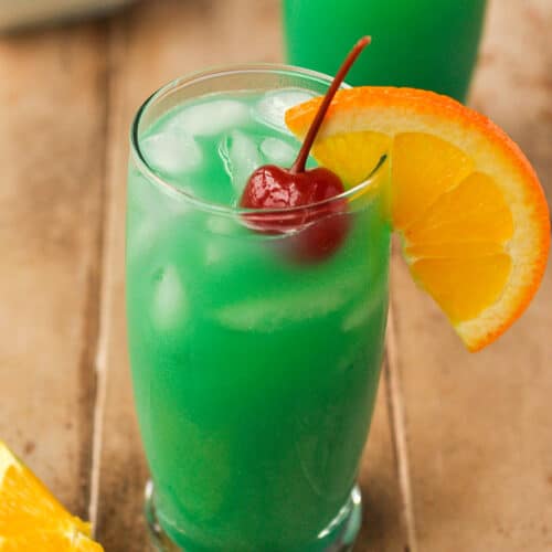 A close up of a Drunken Leprechaun with an orange slice and a cherry.