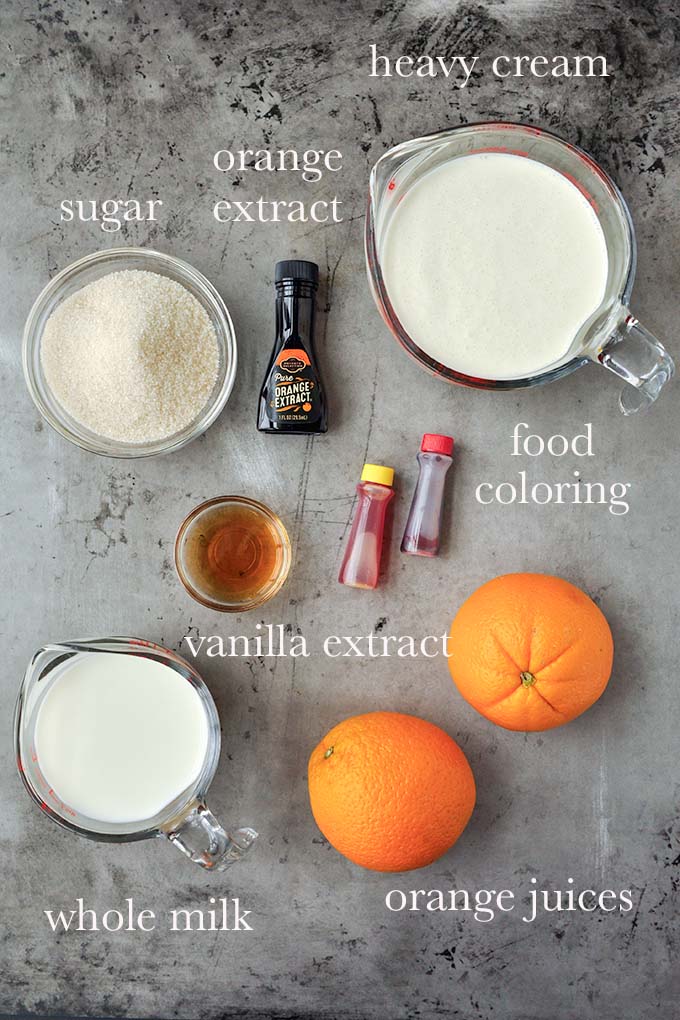 All of the ingredients needed to make orange ice cream.