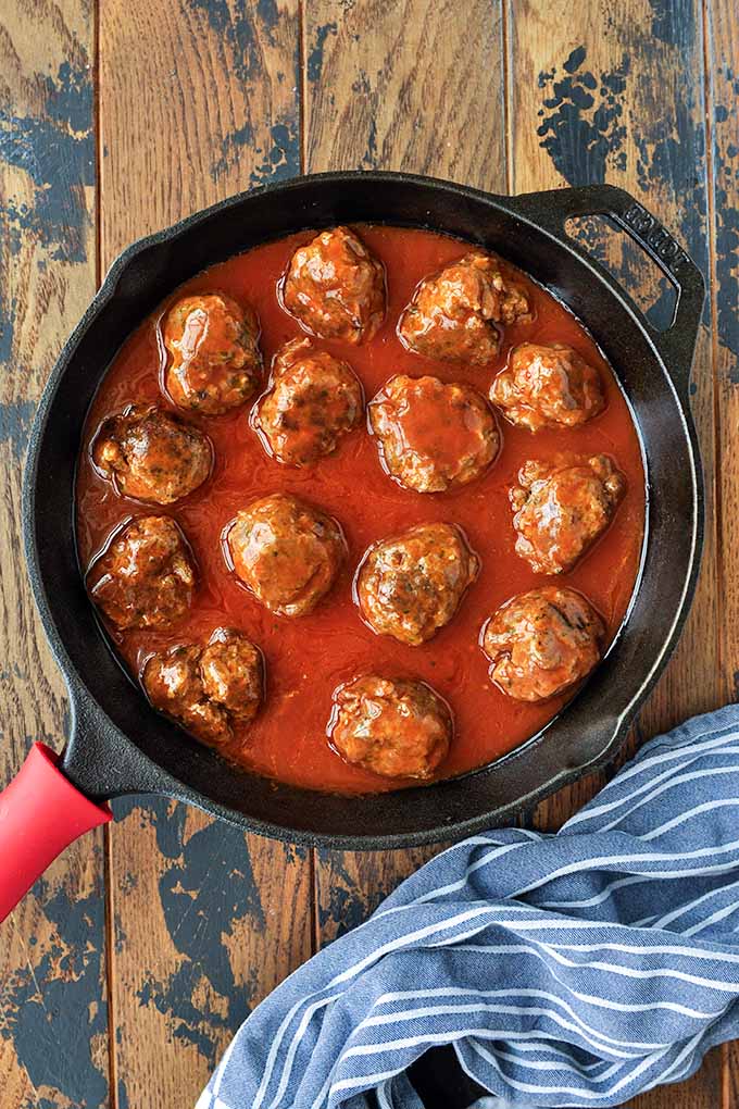 Step three of making meatballs is to cook them and add the enchiladas sauce.