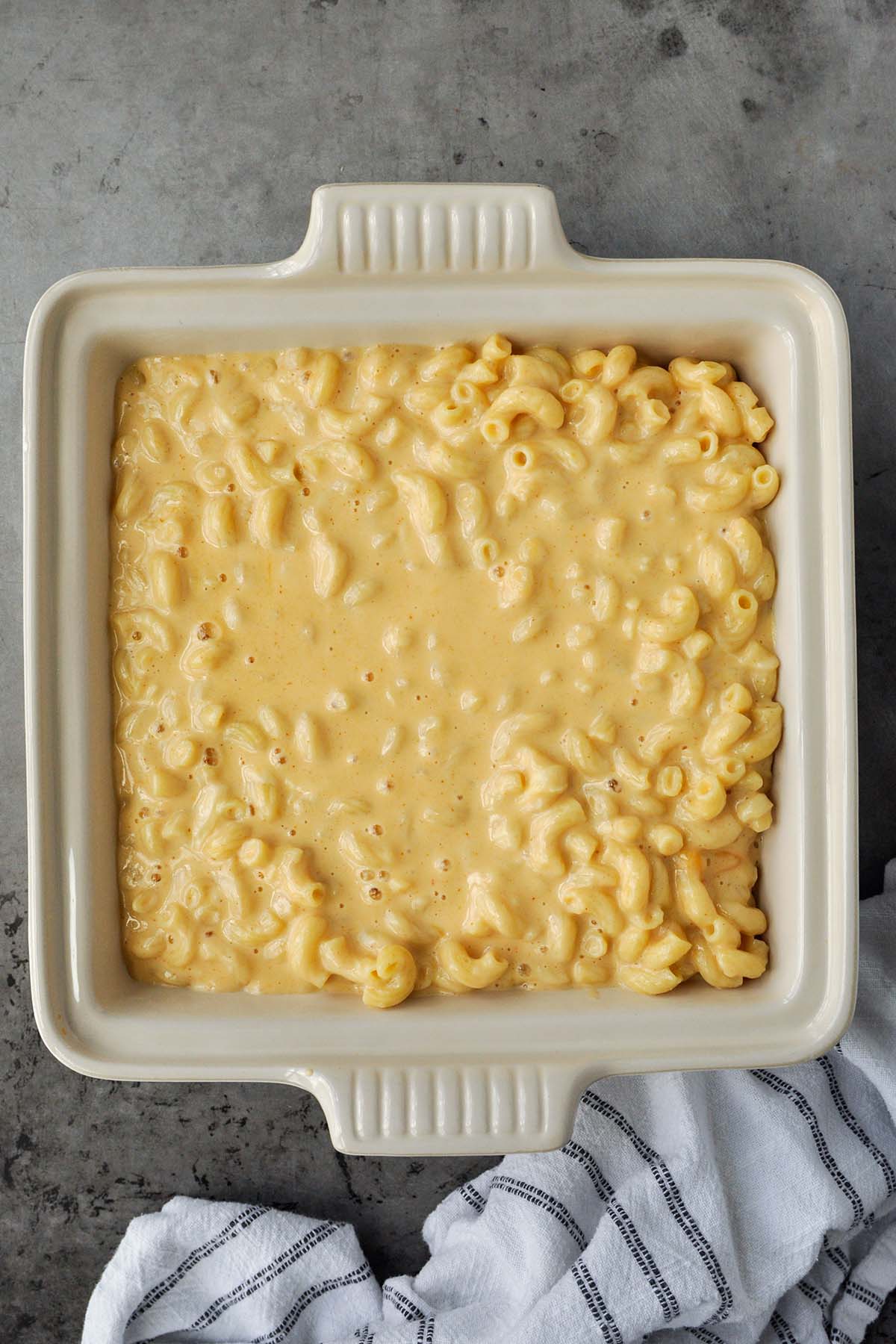 A baking dish of Mac and cheese before adding the Cheetos.