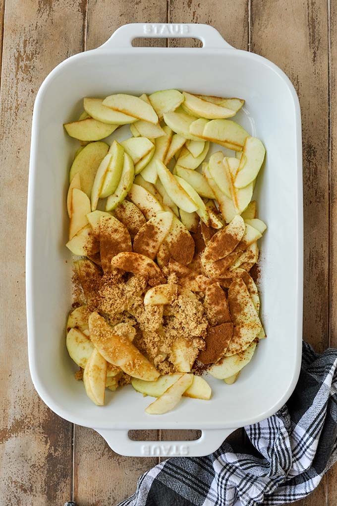 Step three is a baking dish of cut up apples with all the spices added.