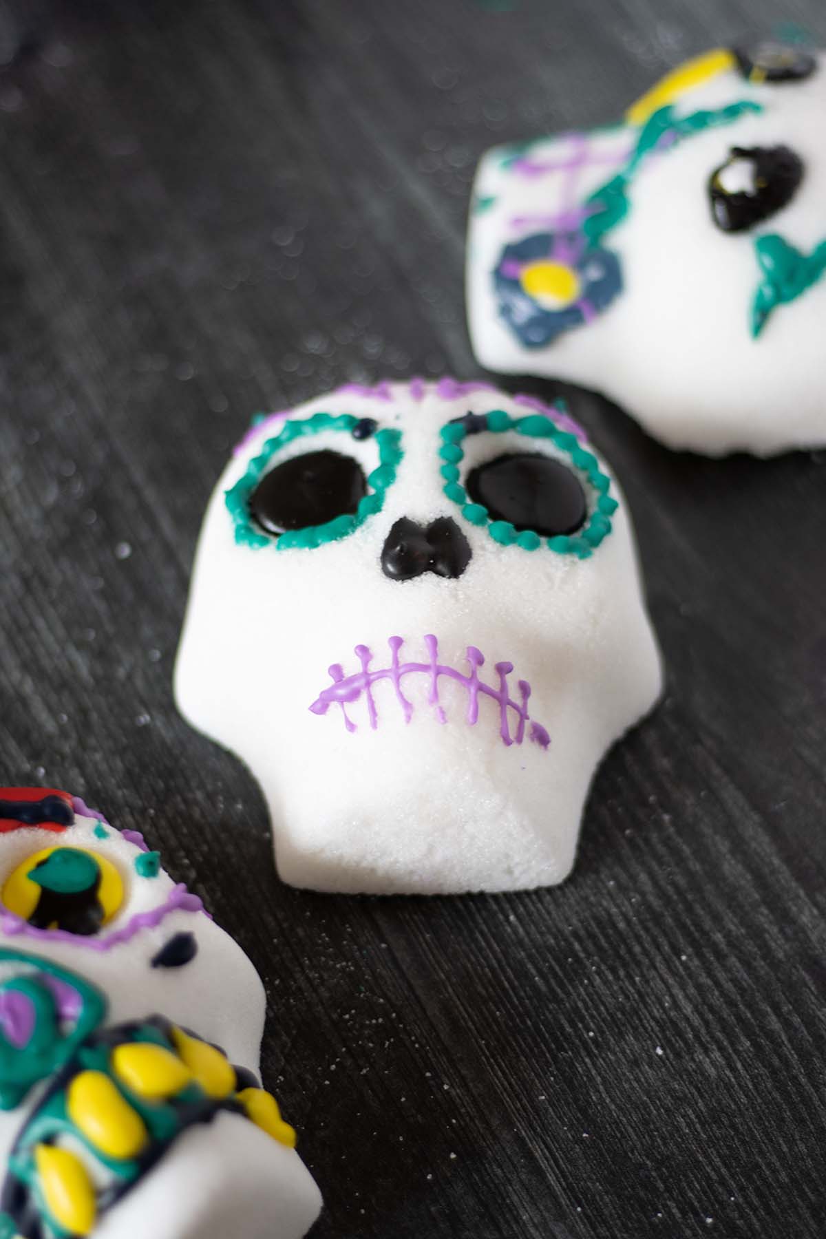 Three decorated sugar skulls.
