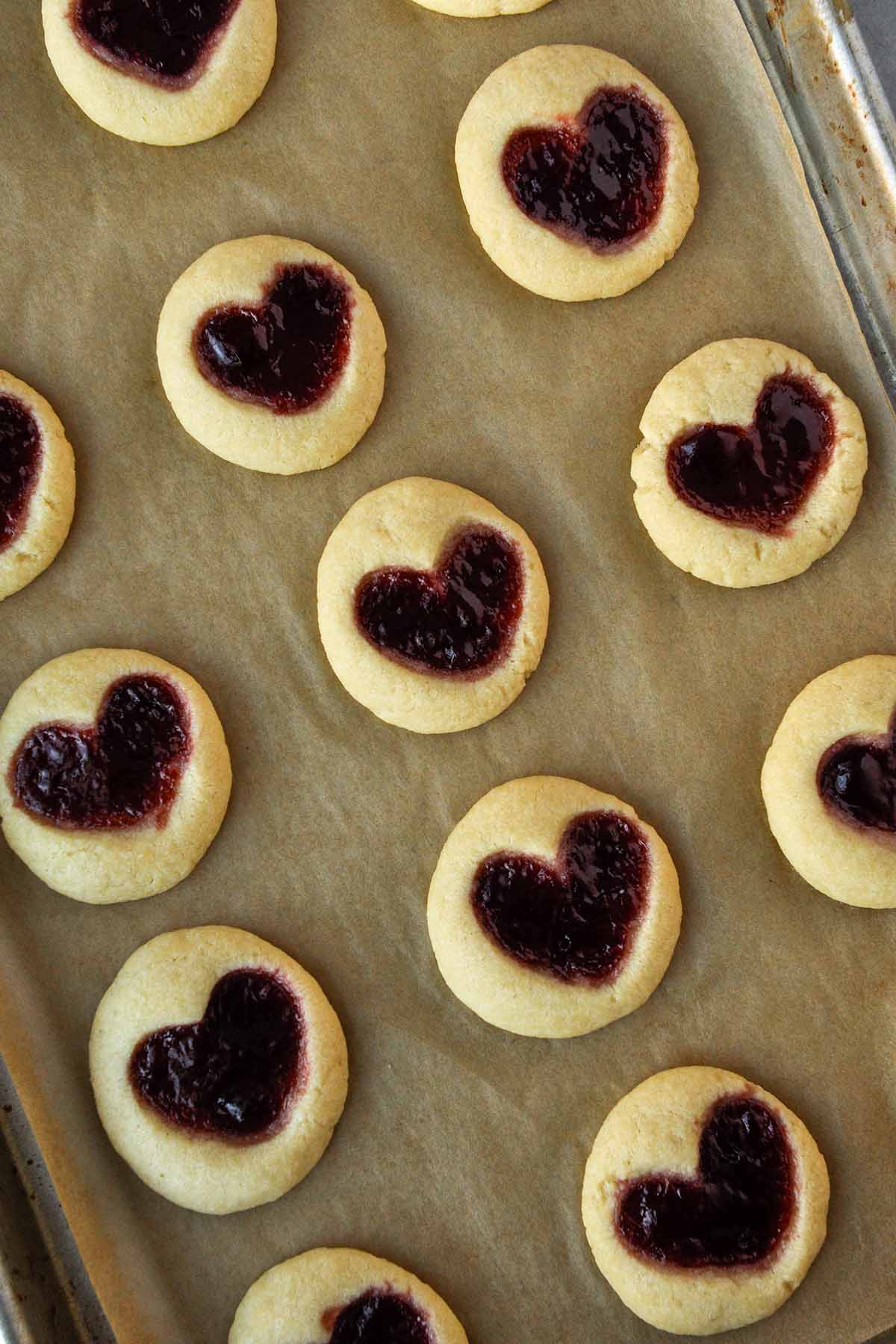 Thumbprint cookies on a baking tray.