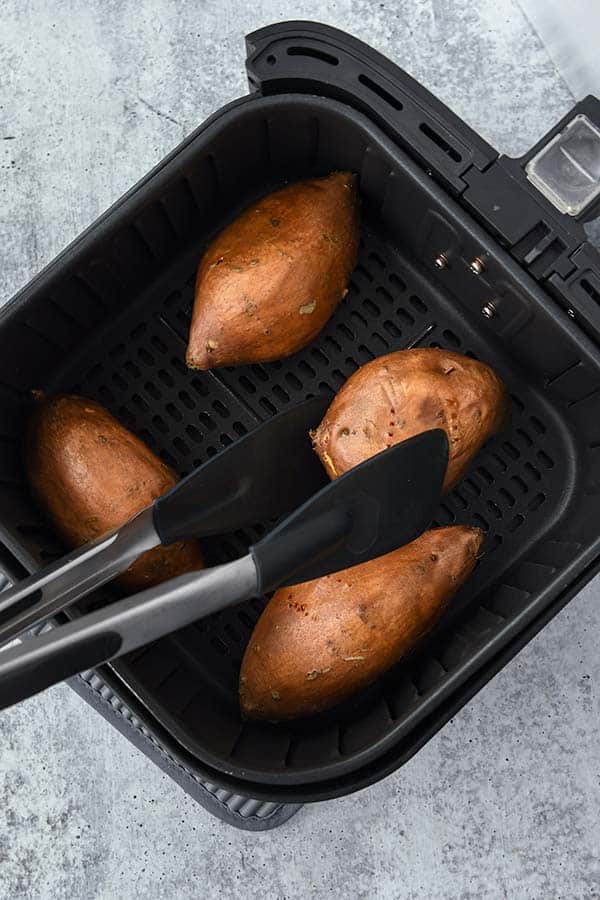Flip over the sweet potatoes halfway through cooking.