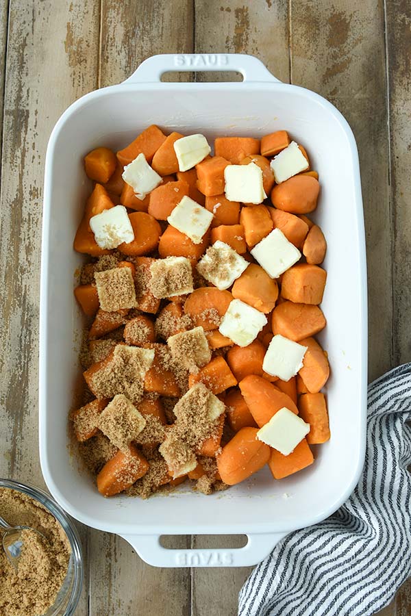 Step three is adding the butter pieces over the sweet potatoes and then covering that with the brown sugar mixture.