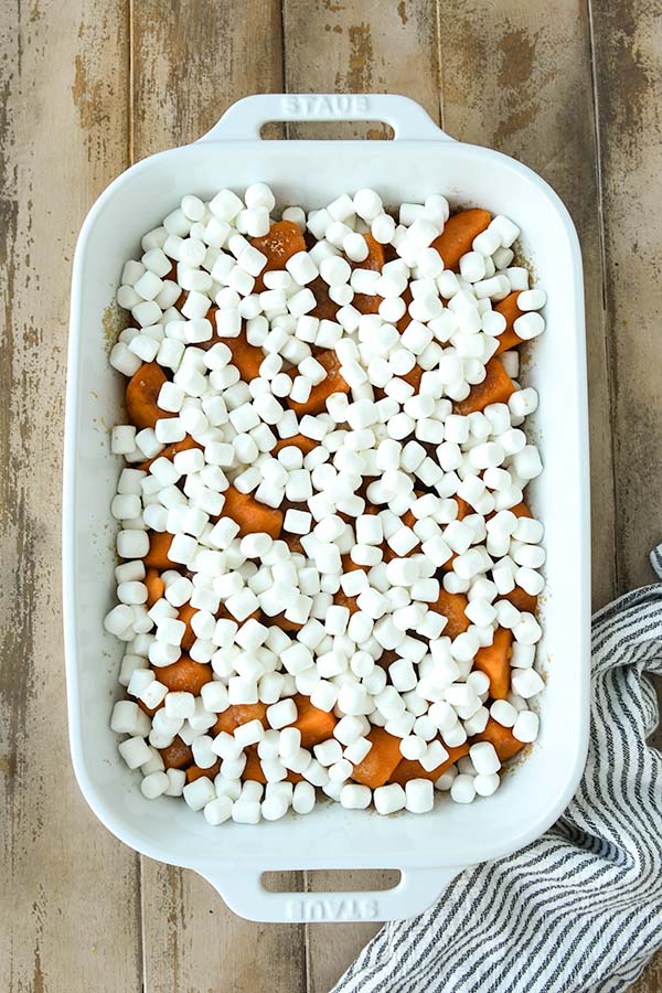 Step four is baking the sweet potatoes then covering the top with marshmallows and putting back in the oven to continue baking.