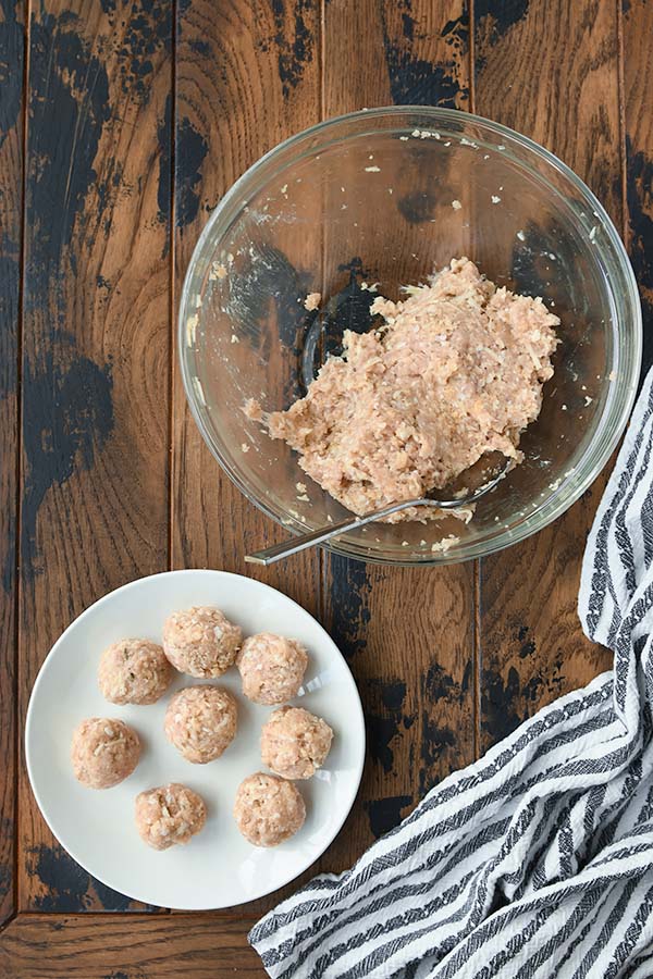Step one is mixing all the ingredients together to make the meat mixture and form into meatballs.