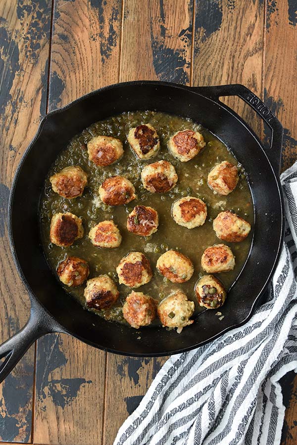 Step six, add the meatballs back in and melt butter in the hot pan.