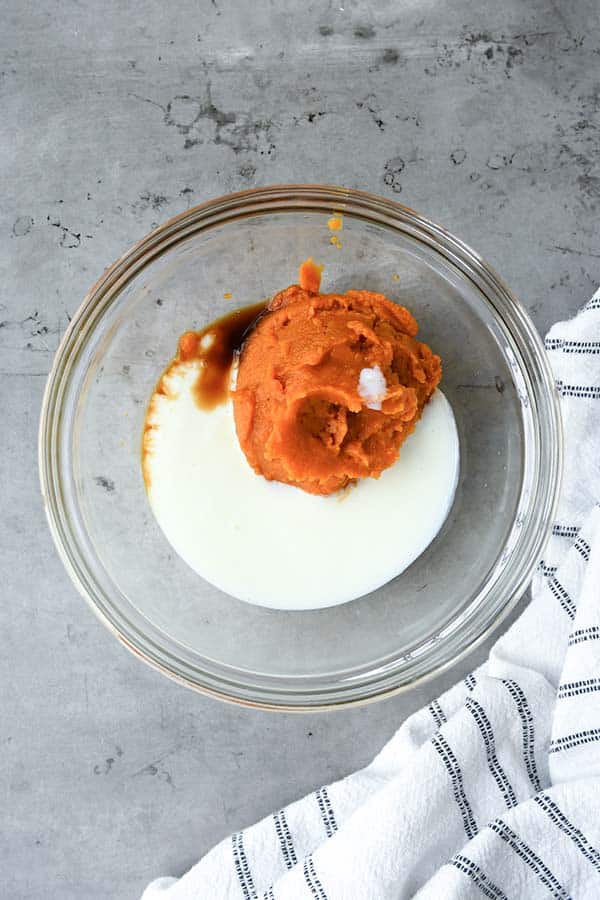 Step one is a small bowl with pumpkin puree, vanilla, and buttermilk.