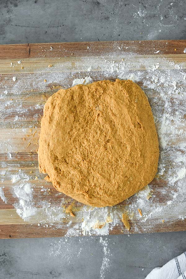 Step 5 is the dough shaped into a circle on a work surface.