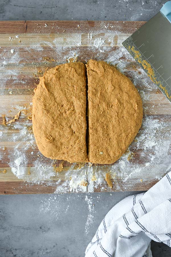 Step seven is the dough reshaped into a circle and cut in half.