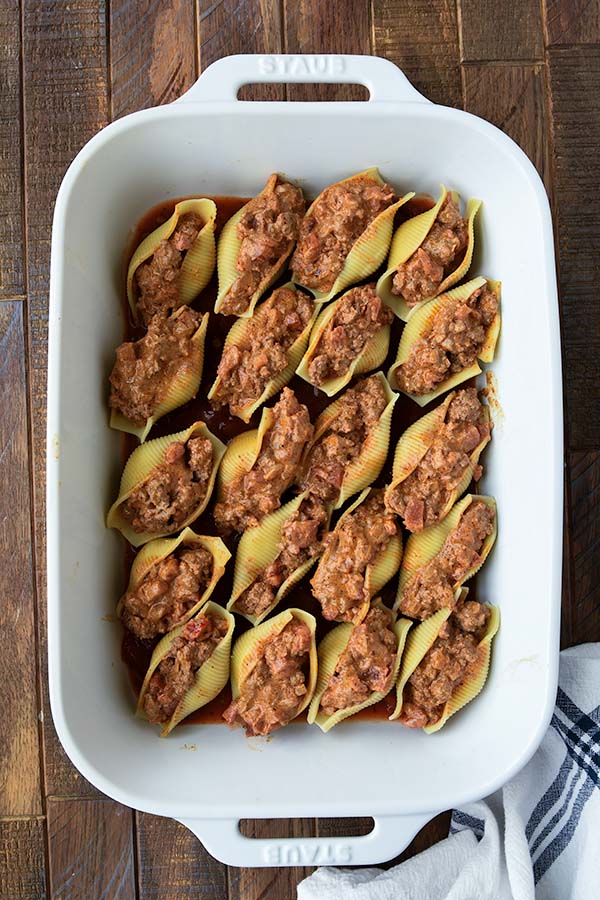 Step six is the baking pan filled with the stuffed shells.