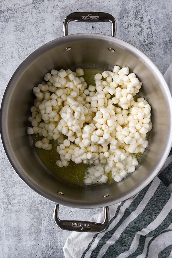 Step one is a pot of melted butter and marshmallows. Stir them together over heat.