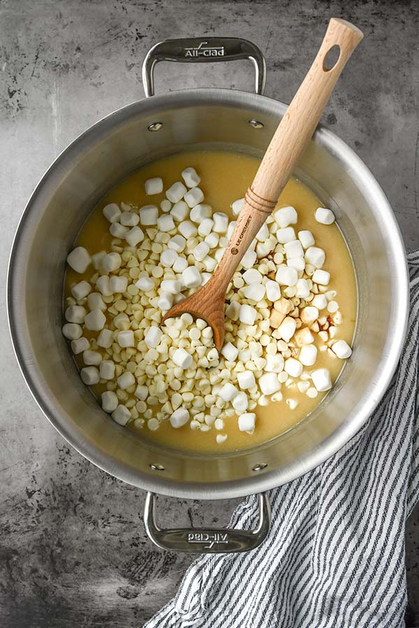 Step two is immediately adding the white chocolate chips, vanilla, and marshmallows