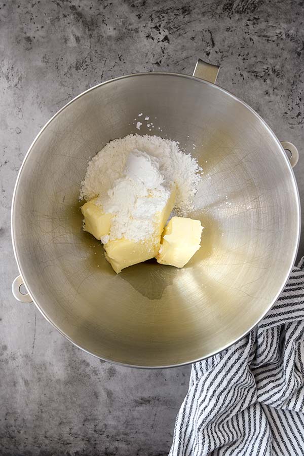Step one is the metal mixing bowl with the powdered sugar and butter added in.