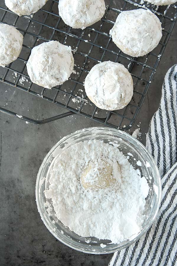 Step 6 is rolling the cookies in two coats of powdered sugar.