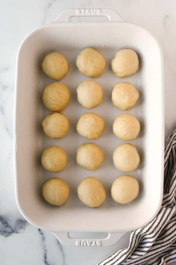 Step seven is to put the dough balls in a 13x9 inch baking pan.