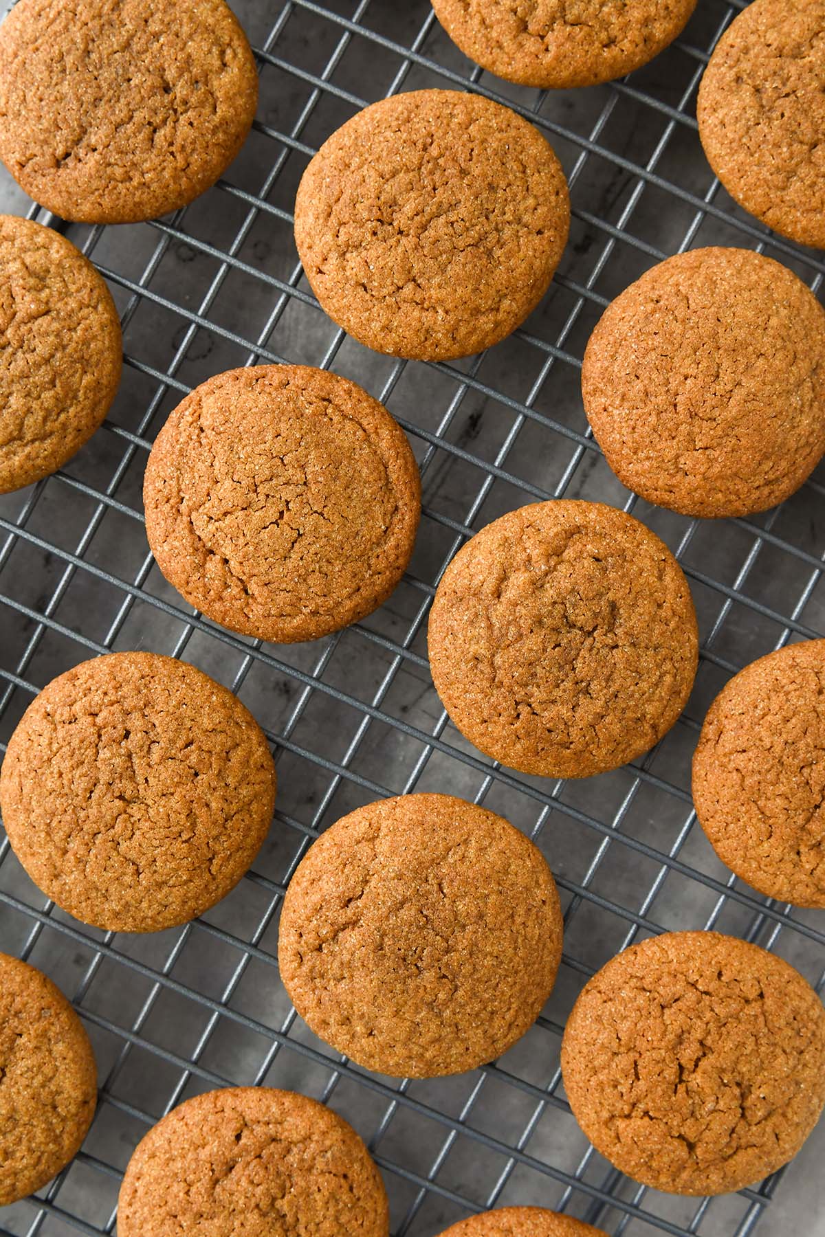 Above view of cookies lined up on a cooling rack.