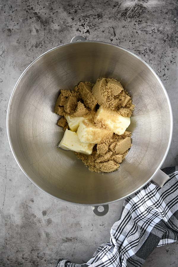 Step two is butter and brown sugar in the bowl of a mixer.