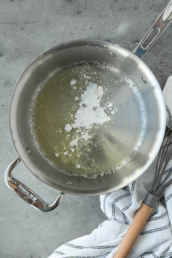 Step one is to boil the peas and then make a roux of flour and butter in a pan.