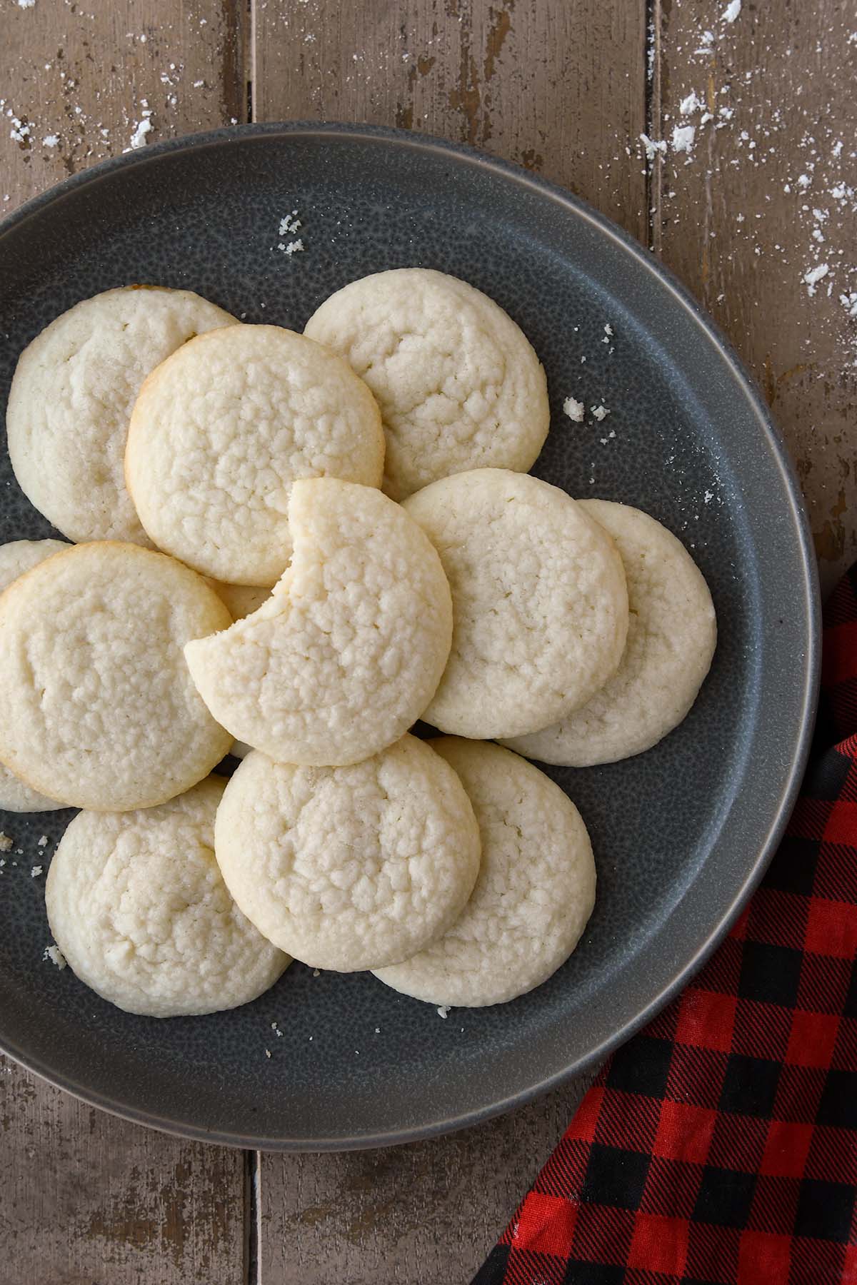 An above view of a plateful of vanilla meltaways with a plaid towel.