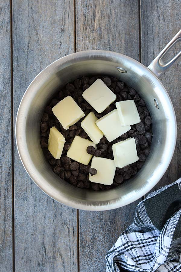 Step one is chocolate chips and butter in a pot.