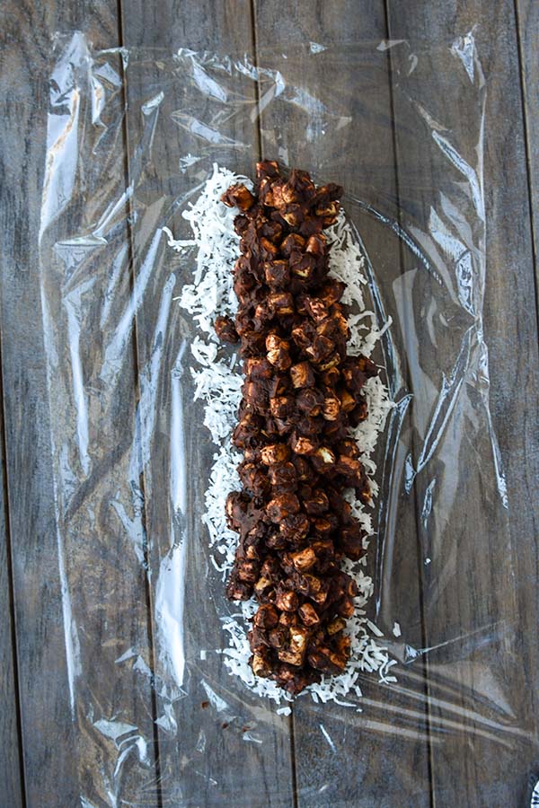 Step four is the chocolate marshmallow mixture added on top of the coconut.