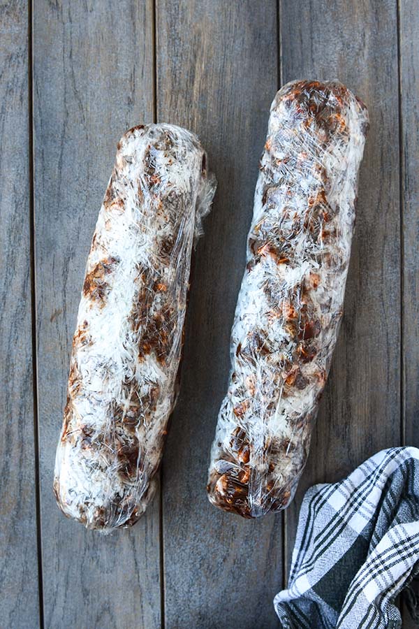 Step six is the two logs of cookie "dough" wrapped up tight to form the cookies.