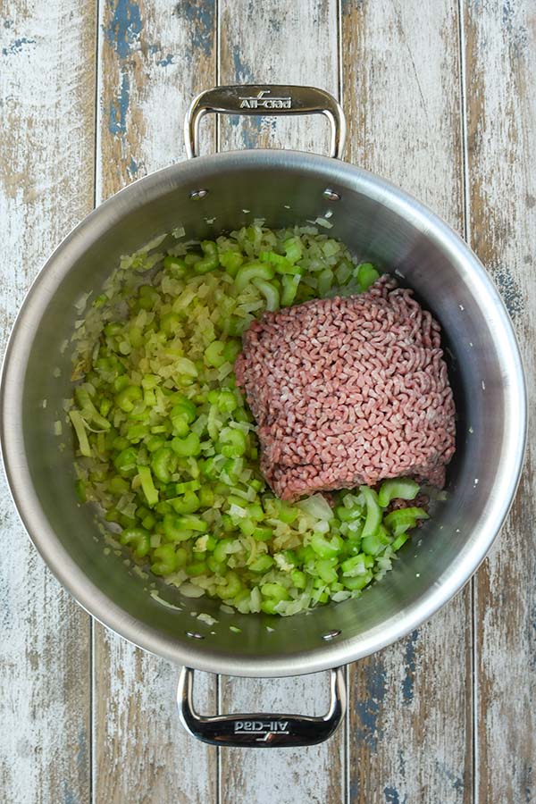 Step two is adding the ground beef in with the softend onions and celery.