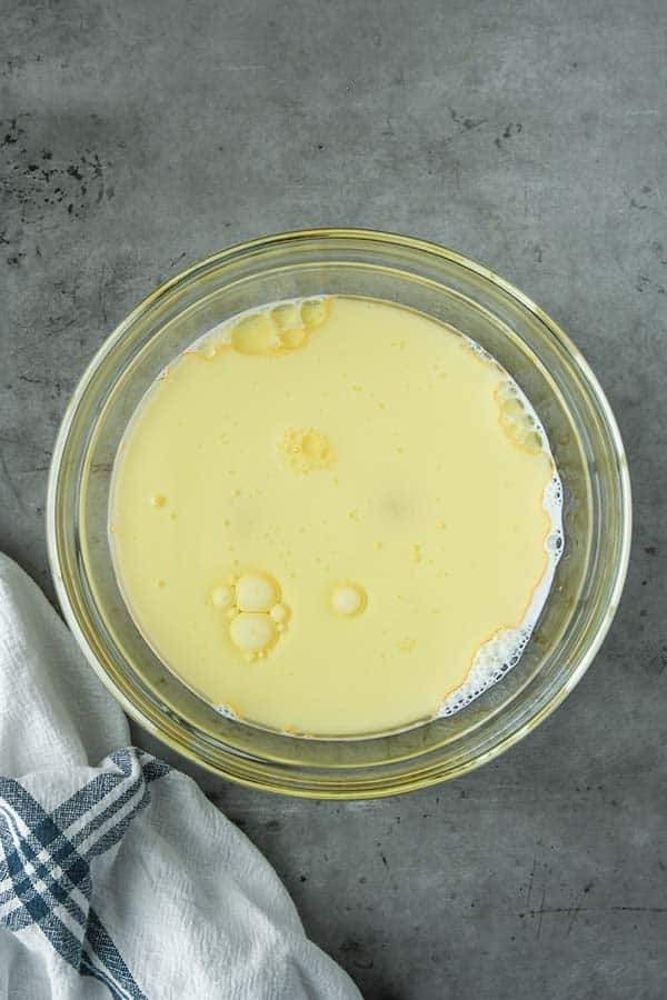 Step two is combining together all of the liquid ingredients in a medium mixing bowl.