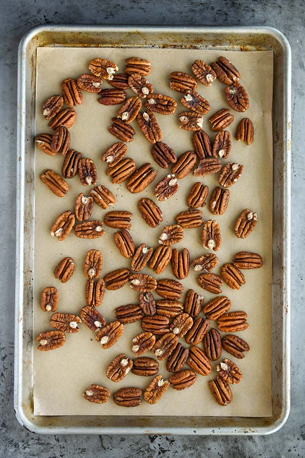 Step one is pecans on baking sheet for toasting.