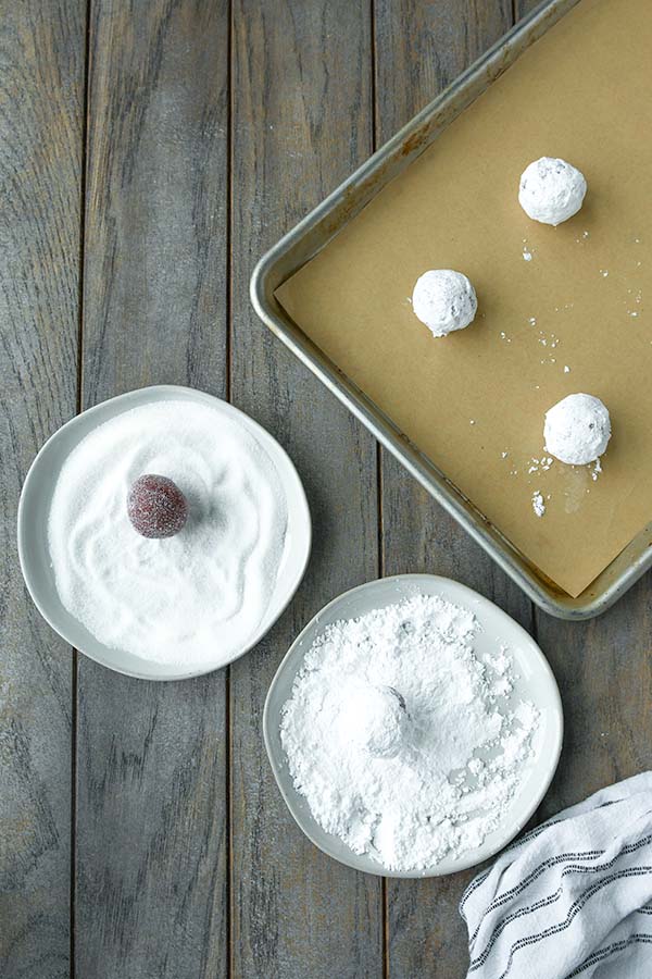 Step seven is rolling the dough into balls and coating them in sugar. Then baking.
