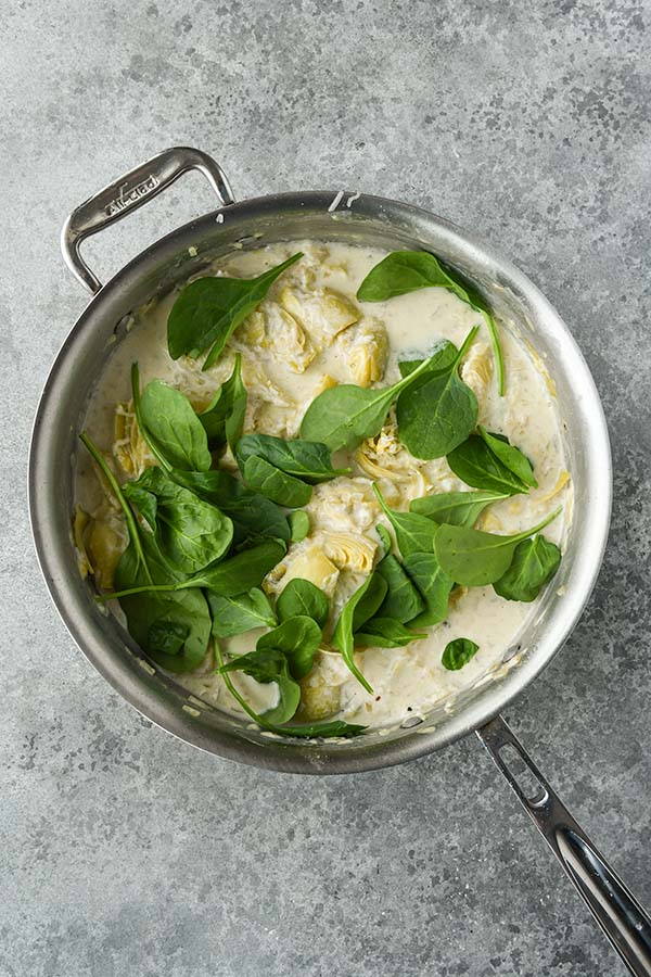 Step eight is adding in another squeeze of lemon and the spinach.